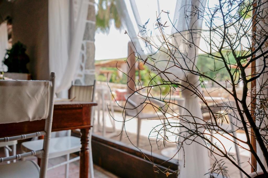 a view of a window with a chair and a table at Il Monastero in Geremèas