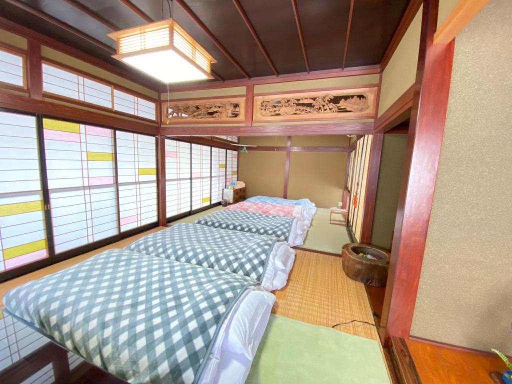 Letto o letti in una camera di ゲストハウス山吹