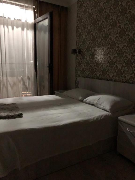 Postel nebo postele na pokoji v ubytování PAPILLON