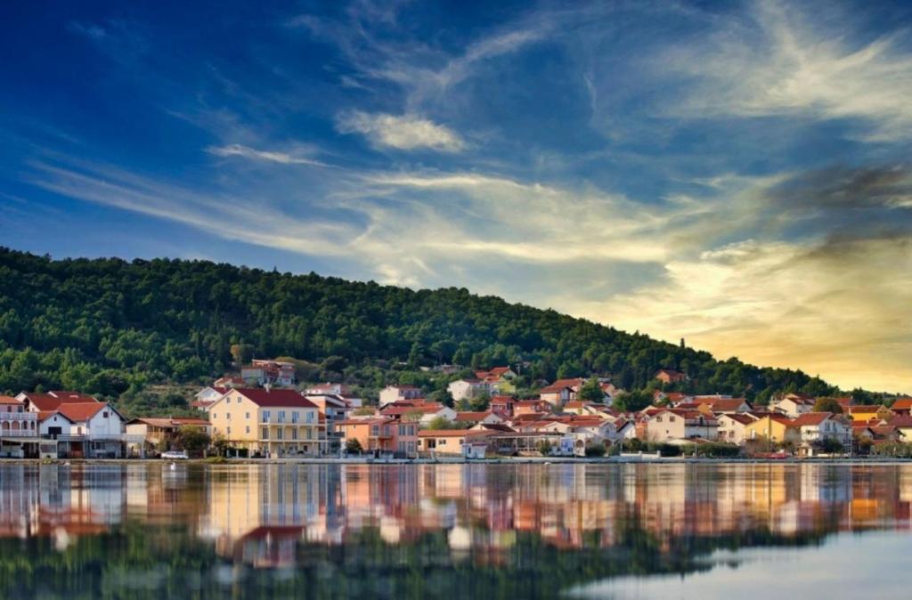 a town on the shore of a large body of water at Nika in Bilice