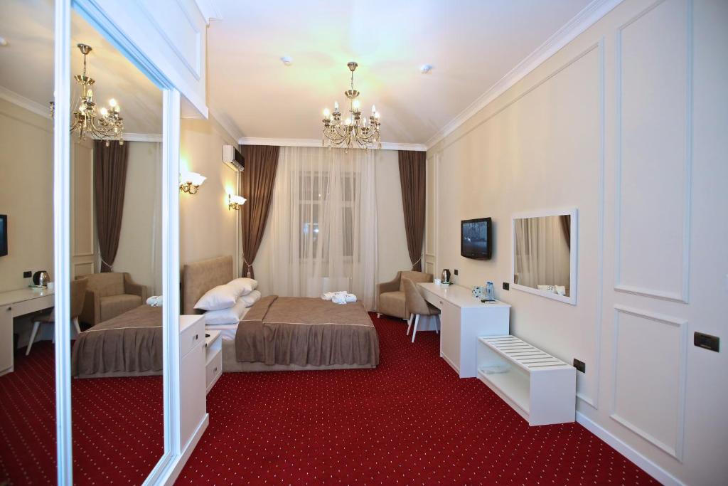 Postel nebo postele na pokoji v ubytování Miraj hotel
