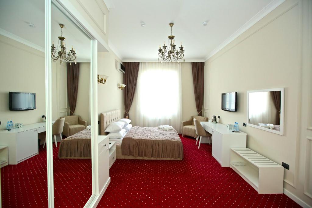Postel nebo postele na pokoji v ubytování Miraj hotel