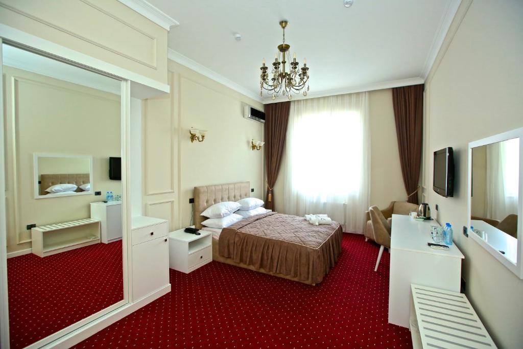 Postel nebo postele na pokoji v ubytování Miraj hotel
