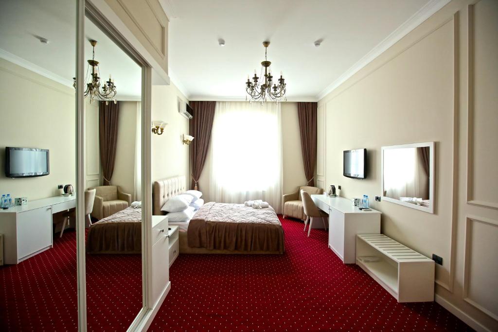 Postel nebo postele na pokoji v ubytování Miraj hotel