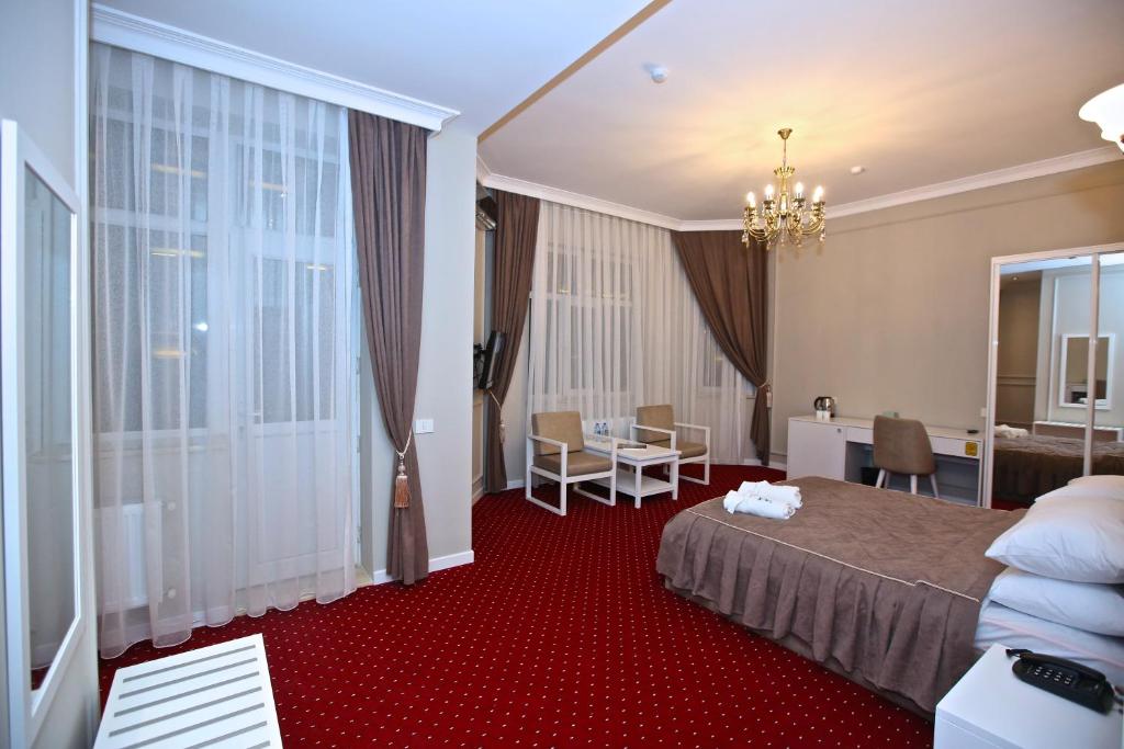 Postel nebo postele na pokoji v ubytování Miraj hotel