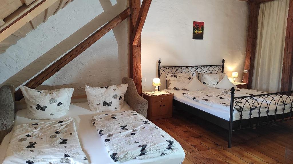 a bedroom with two beds and a staircase at Maurushaus in Füssen