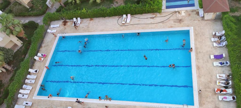 an overhead view of a large swimming pool at Lara beach furnıshed flat in Lara