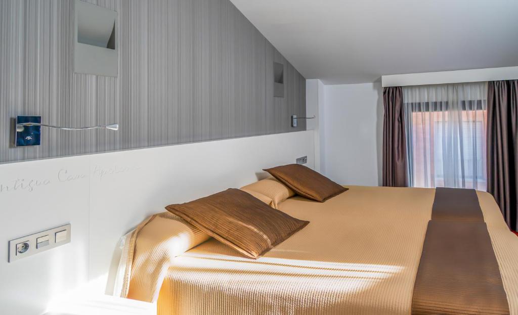 Postel nebo postele na pokoji v ubytování Hotel Apolonia Soria