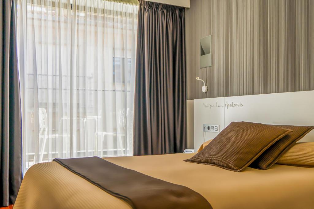 Postel nebo postele na pokoji v ubytování Hotel Apolonia Soria