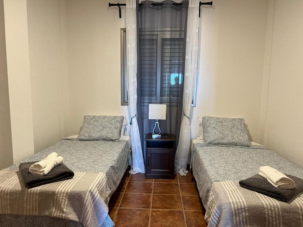 Postel nebo postele na pokoji v ubytování Apartamentos Vista Marina - El Médano