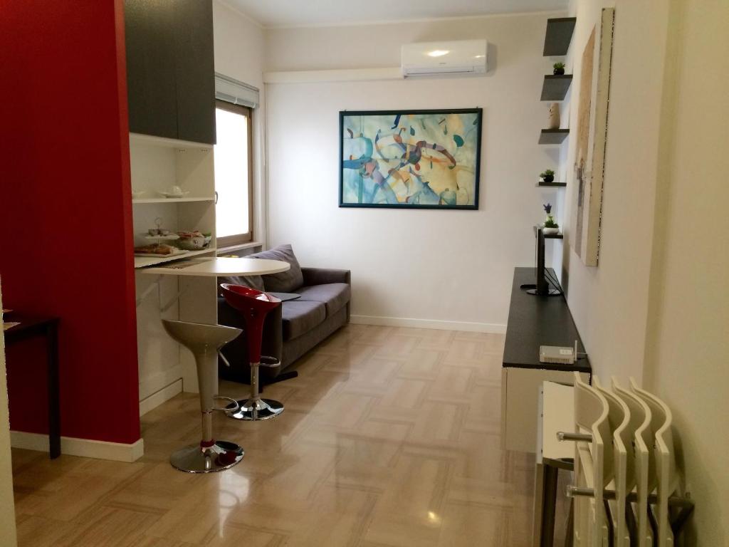 a living room with a couch and a table at Pescara Center Apartment in Pescara