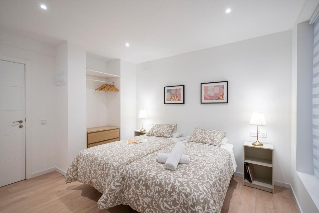 Postel nebo postele na pokoji v ubytování Room Plaza España