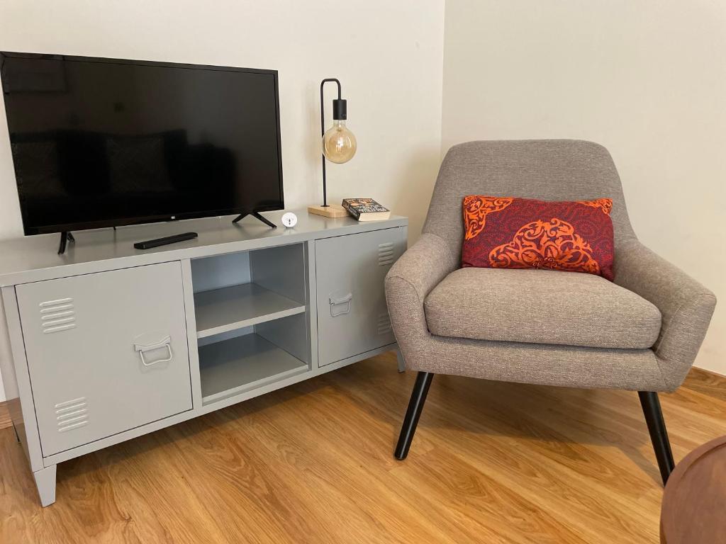 Telewizja i/lub zestaw kina domowego w obiekcie GES Homes
