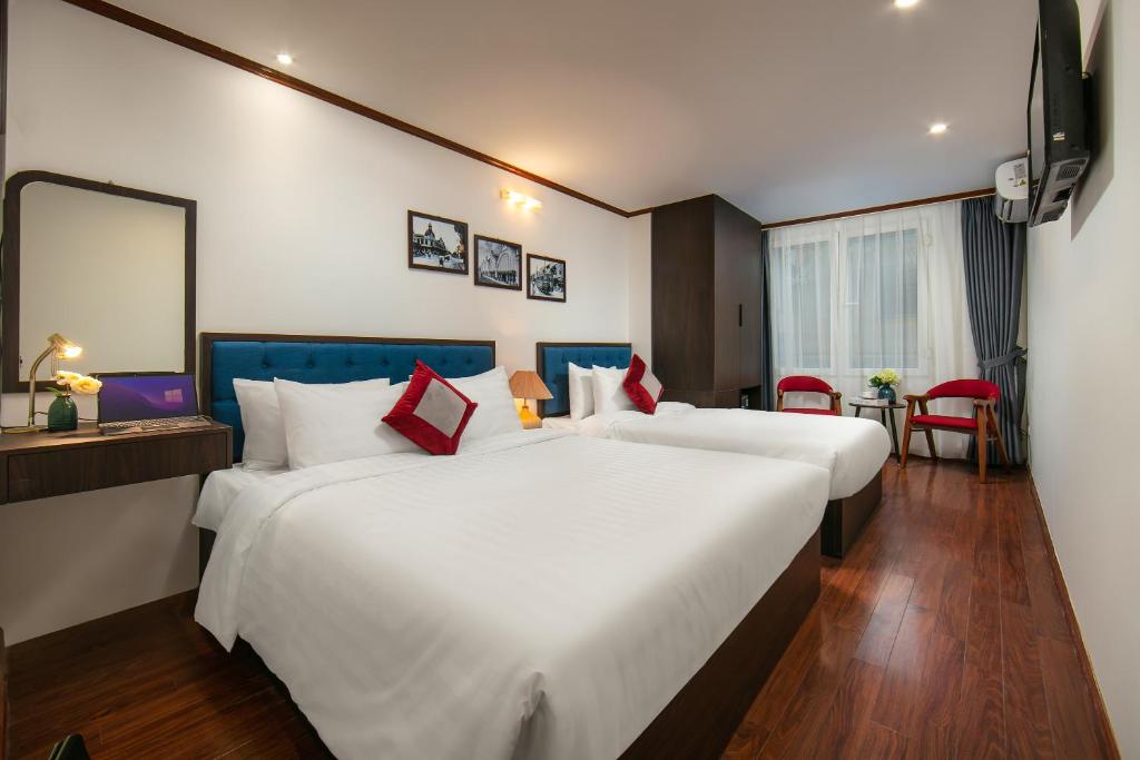 Postel nebo postele na pokoji v ubytování Silk Flower Hotel & Spa