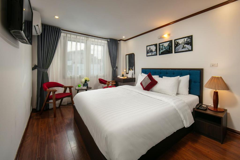 Postel nebo postele na pokoji v ubytování Silk Flower Hotel & Spa