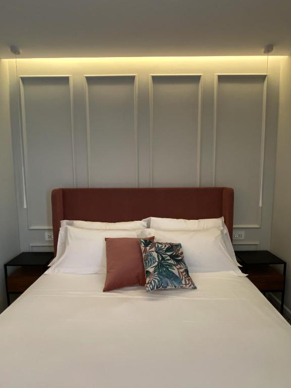 Postel nebo postele na pokoji v ubytování NoOne Tropea Guesthouse