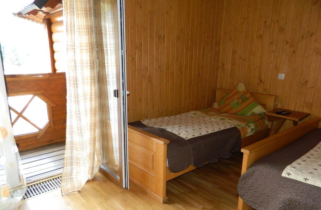 Postel nebo postele na pokoji v ubytování U Stozi Hotel