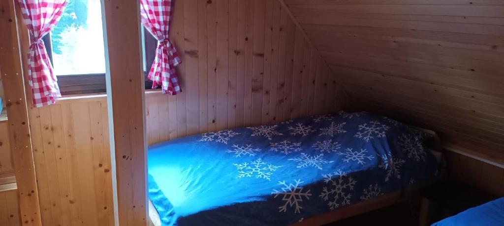 Postel nebo postele na pokoji v ubytování Planinska hišica pod macesni - Bohinj