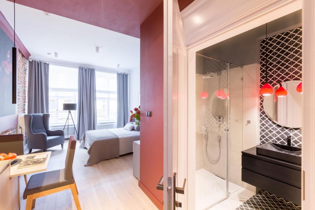 Posteľ alebo postele v izbe v ubytovaní Cadena Gallery Apartments Matejko