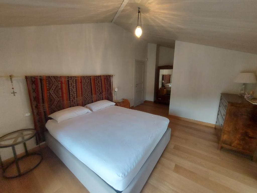 Postel nebo postele na pokoji v ubytování Palazzo Scura