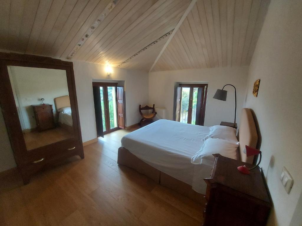 Postel nebo postele na pokoji v ubytování Palazzo Scura