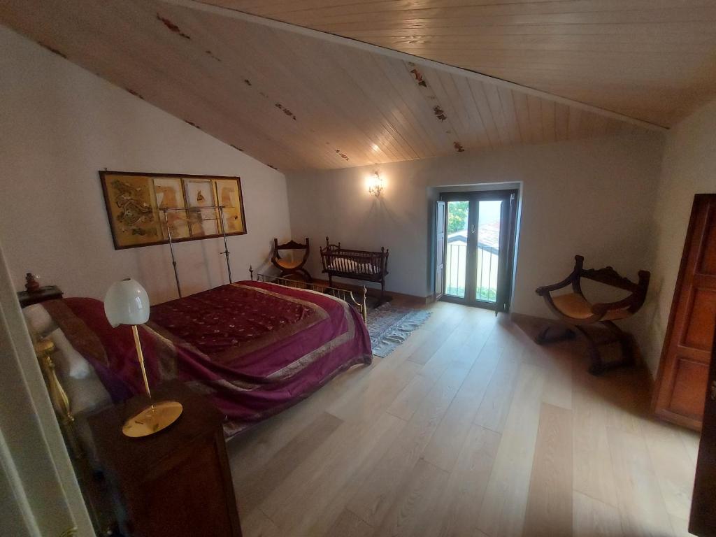 Postel nebo postele na pokoji v ubytování Palazzo Scura