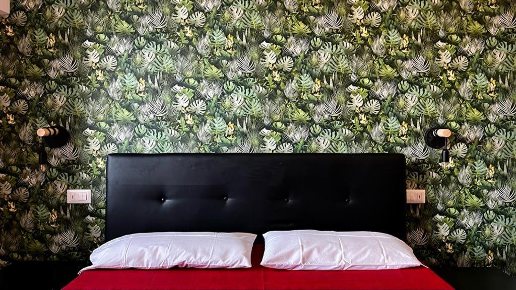 A bed or beds in a room at Casa di Charlie
