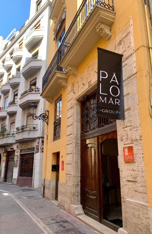 a sign on the side of a building at Palau de Palomar - PalomarGroup in Valencia