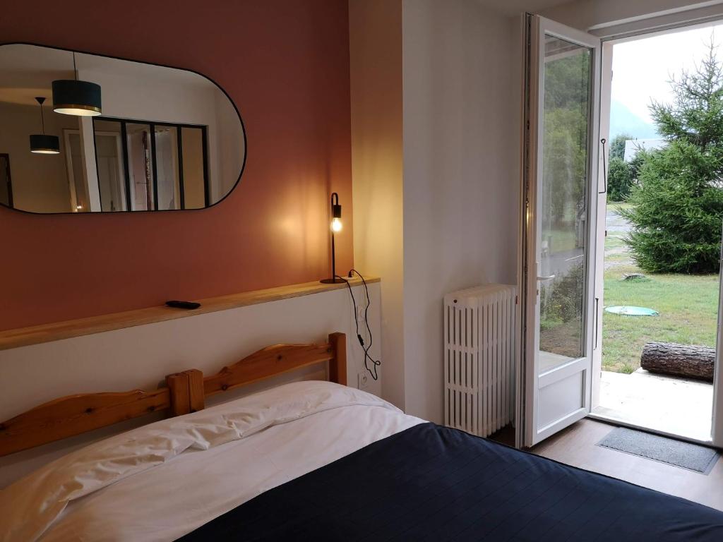Postel nebo postele na pokoji v ubytování Le Relais d'Avajan