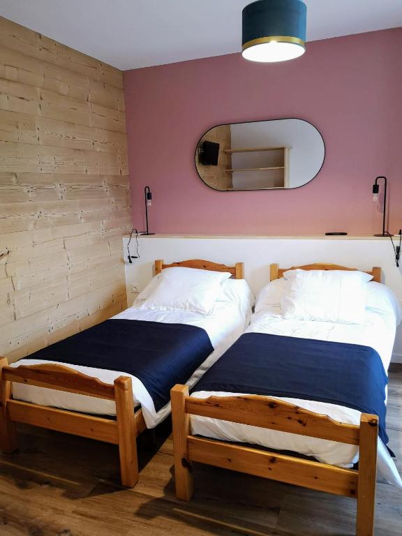 Postel nebo postele na pokoji v ubytování Le Relais d'Avajan