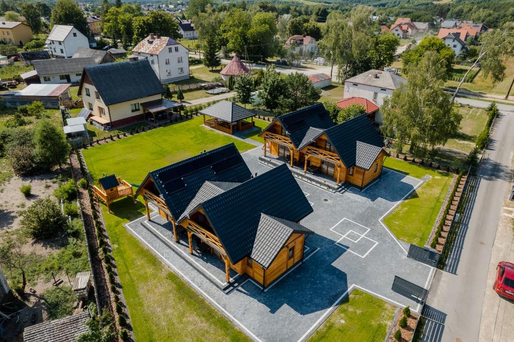 an overhead view of a house with a yard at Domki przy Alei in Krasnobród