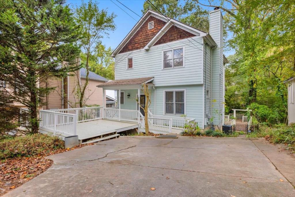 a white house with a porch and a driveway at Atlanta Private Charming Room 2 in Atlanta