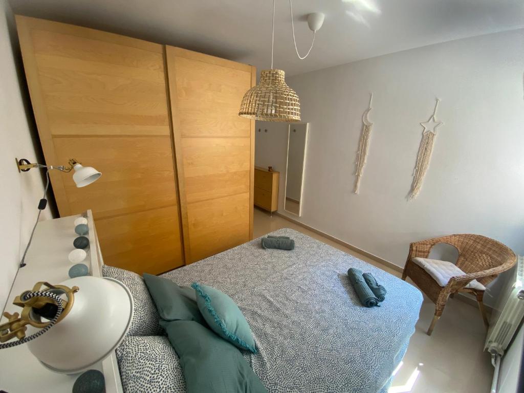 Postel nebo postele na pokoji v ubytování Topitos Apartment Casc Antic
