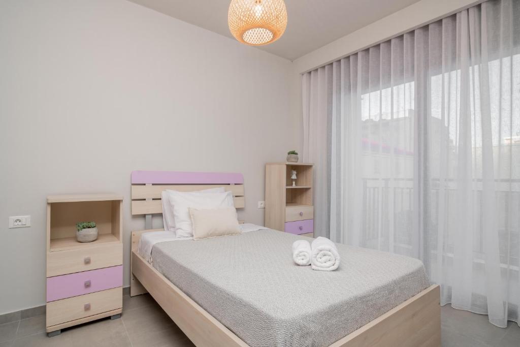 Postel nebo postele na pokoji v ubytování ANEMA STYLISH RESIDENCE