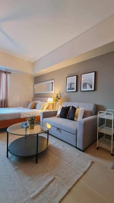 a living room with a couch and a table at The Nook at Serin Tagaytay in Tagaytay