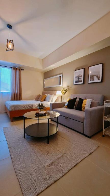 a large living room with a couch and a table at The Nook at Serin Tagaytay in Tagaytay