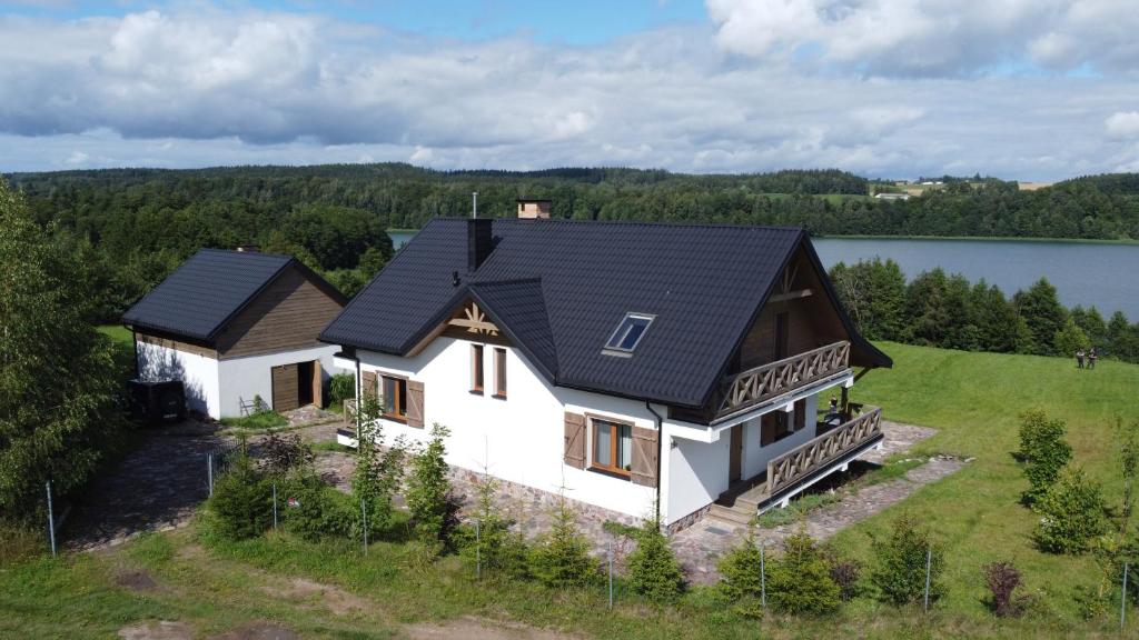 an aerial view of a house with a black roof at Azyl Apetytu in Filipów