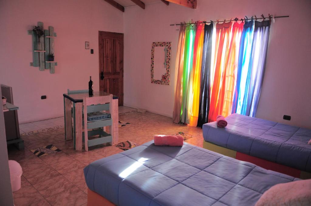 a living room with a couch and a table at Estudio Los Mosaicos in Vicuña