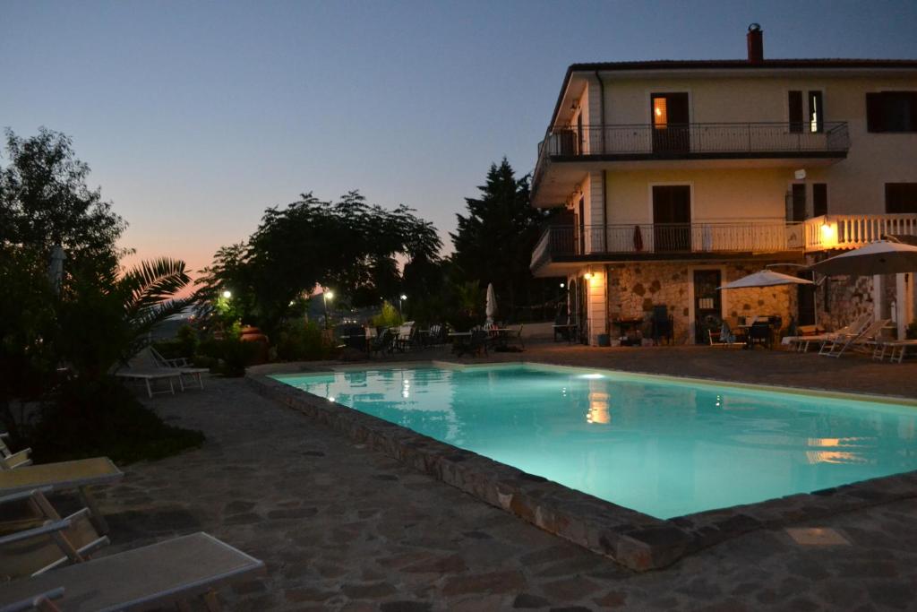 a large swimming pool in front of a house at Villa Malandrino Guest House in Agropoli