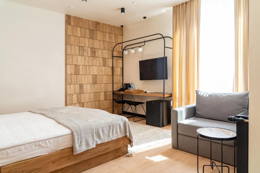 Postel nebo postele na pokoji v ubytování Bukville Hotel & SPA
