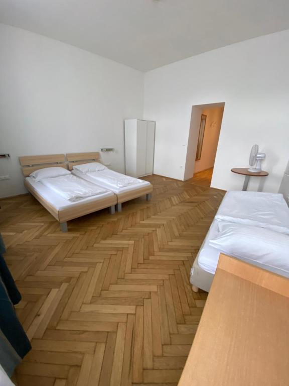 Postel nebo postele na pokoji v ubytování Kolbeck Rooms