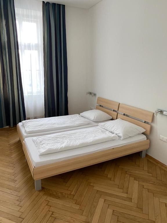 Postel nebo postele na pokoji v ubytování Kolbeck Rooms