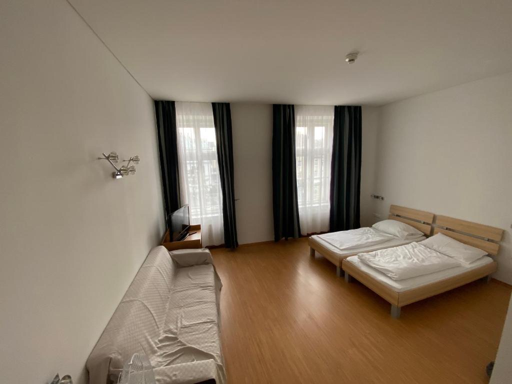 Postel nebo postele na pokoji v ubytování Kolbeck Rooms