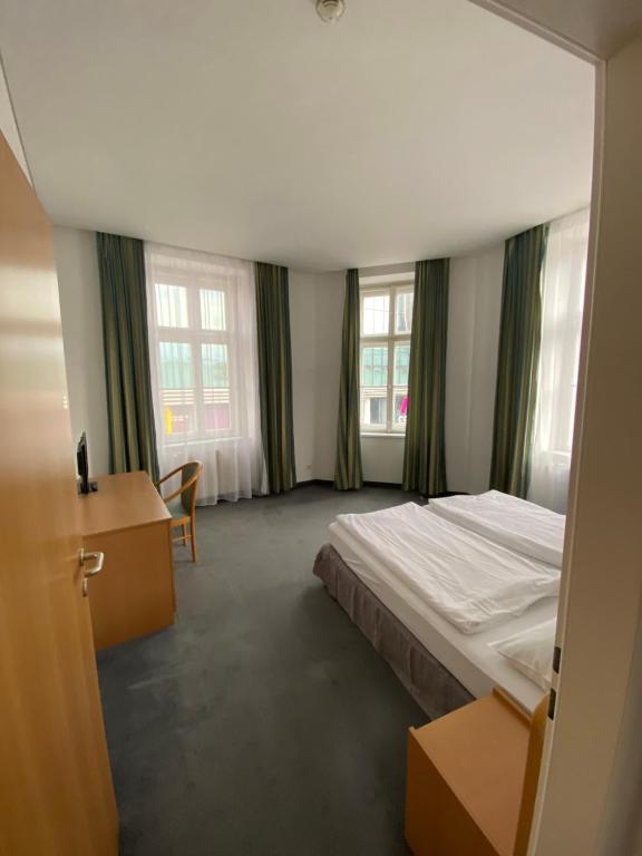 Postel nebo postele na pokoji v ubytování Kolbeck Rooms