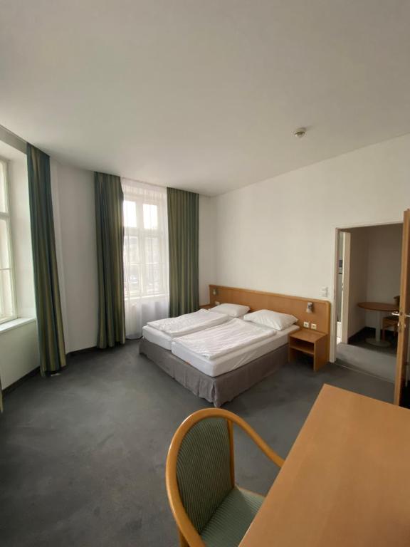 Postel nebo postele na pokoji v ubytování Kolbeck Rooms