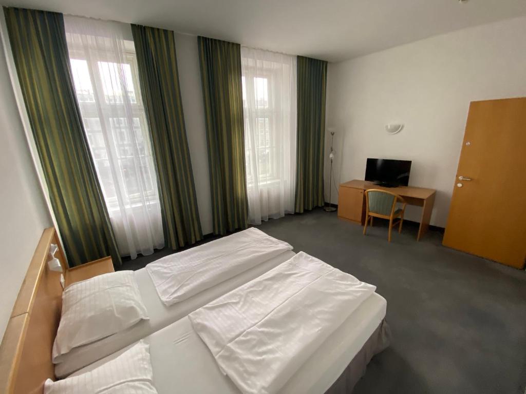 Postel nebo postele na pokoji v ubytování Kolbeck Rooms