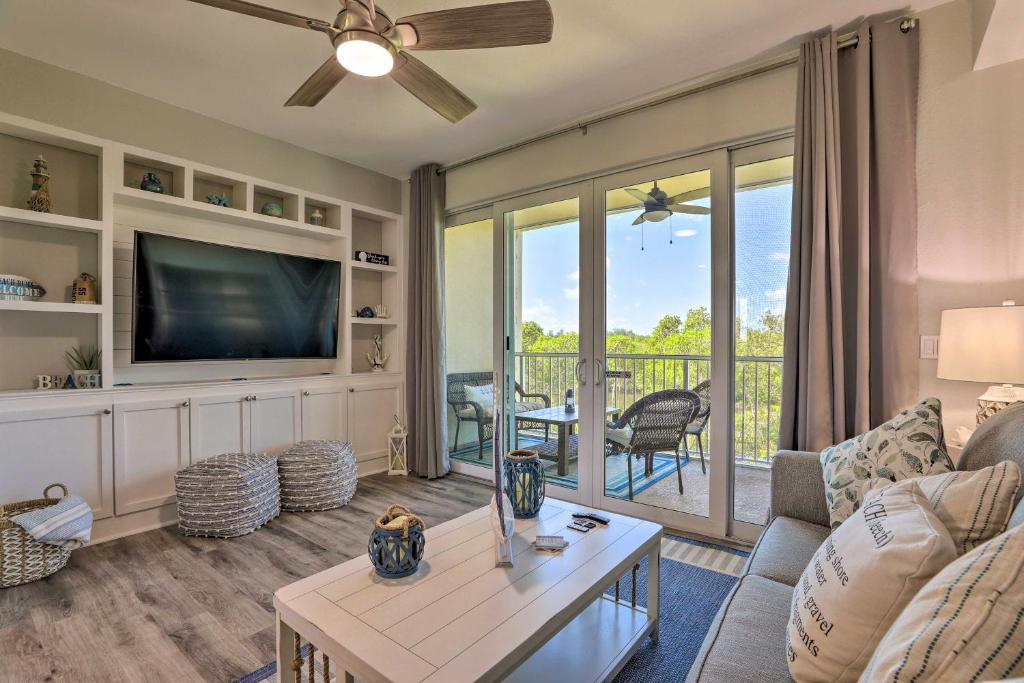 a living room with a couch and a tv at Coastal-Zen Ruskin Retreat Less Than 1 Mi to Beach! in Ruskin