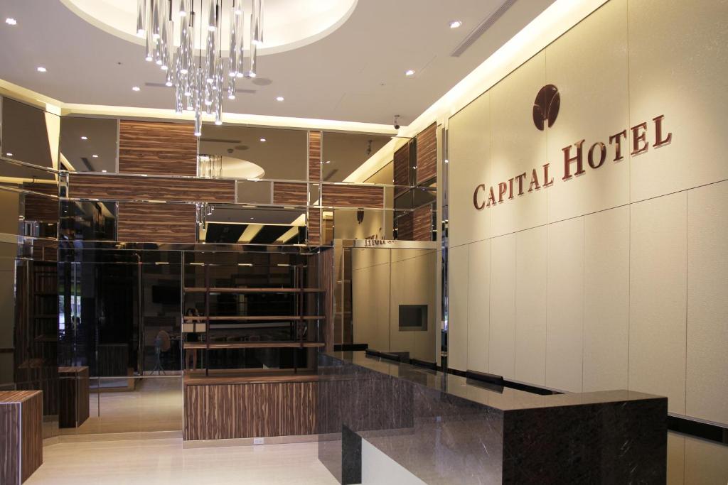 a lobby of a central hotel with a chandelier at Capital Hotel SongShan in Taipei
