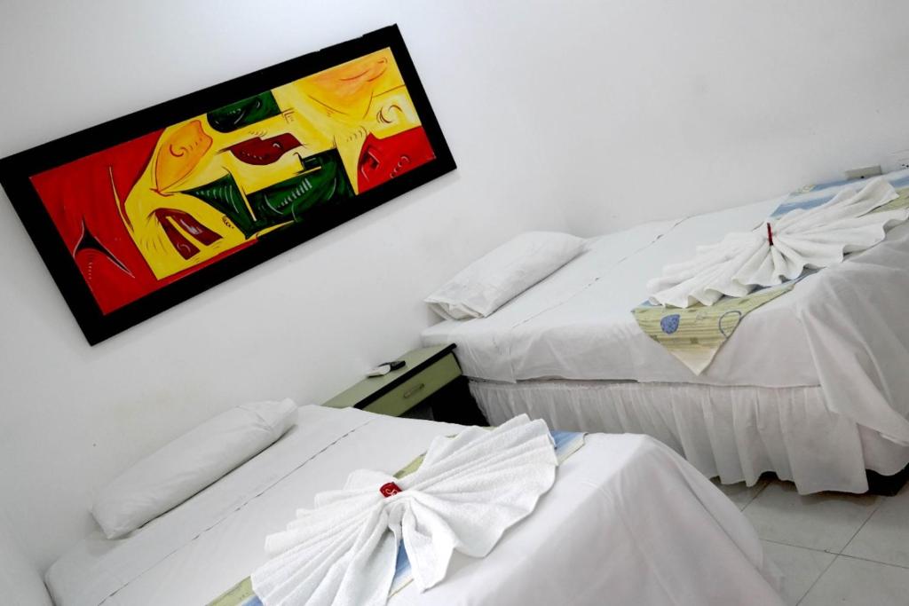 Postel nebo postele na pokoji v ubytování Comodas Habitaciones Hotel Bucaros