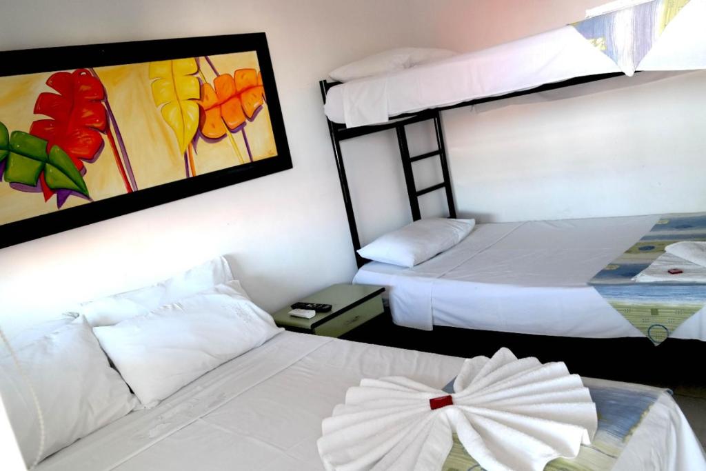 Postel nebo postele na pokoji v ubytování Comodas Habitaciones Hotel Bucaros